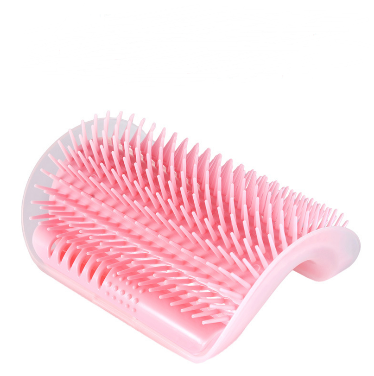 Pink pet grooming brush on a white background