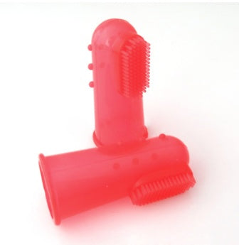Red silicone baby brush on a white background